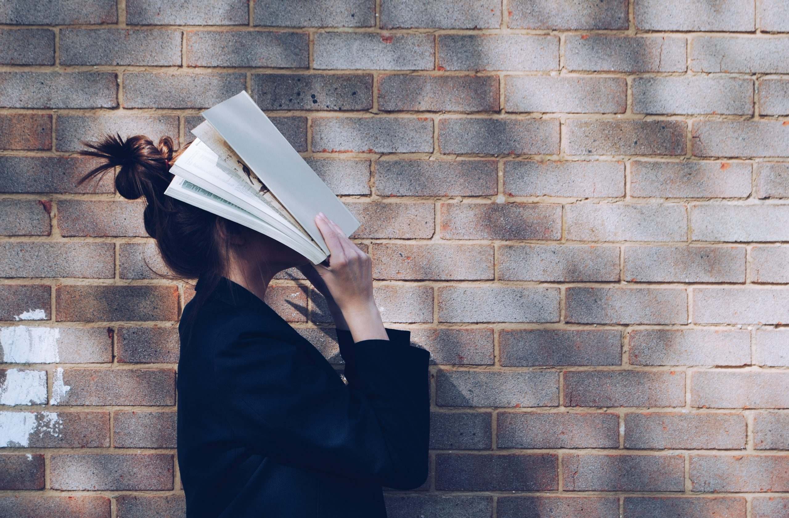 A woman with a book on her face in Australia