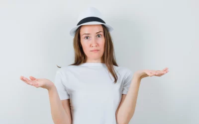 Person in white shirt and hat shrugging with confused expression.